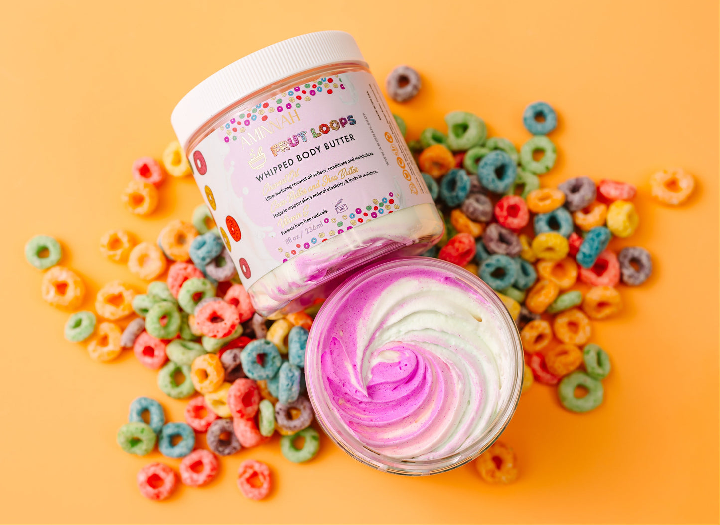 Body butter with colorful packaging surrounded by cereal on a yellow background. Assorted beauty products including bottles and jars on a colorful background with cereal pieces. "FRUT LOOPS" BUNDLE - Bath & Body Gift Set What’s included
Whipped Body Butter • Sugar Scrub • Body Oil • Lip Gloss — a full routine for ultra-hydrated, smooth, radiant results.
