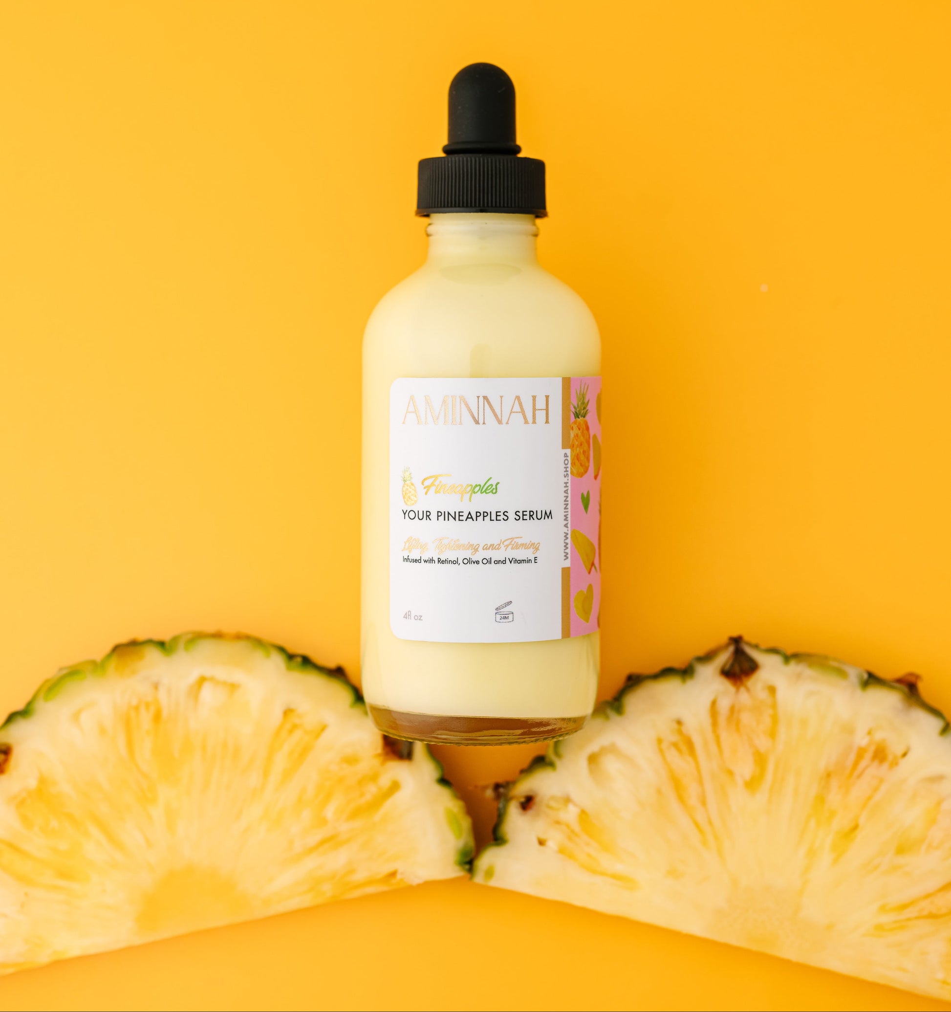 Bottle of pineapple serum with a dropper on a yellow background with pineapple slices. Two bottles of 'Ninah' hair treatment serum on a yellow background. Pineapple and skincare products on a yellow background. Bottle of pineapple serum with a dropper on a yellow background with pineapple slices. FIneapples anti-aging skin serum Vial 