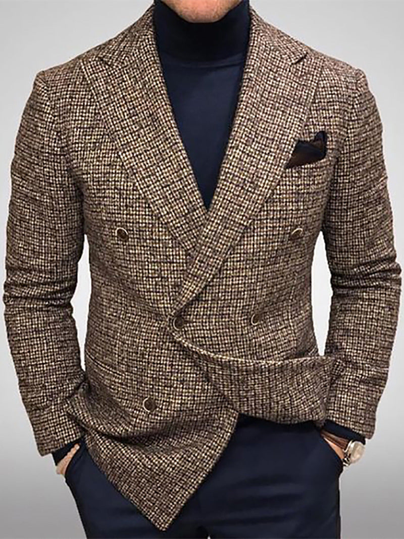 Brown checkered blazer worn by a person on a gray background