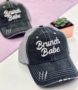 Black and white cap with 'Brunch Babe' text on a pink background