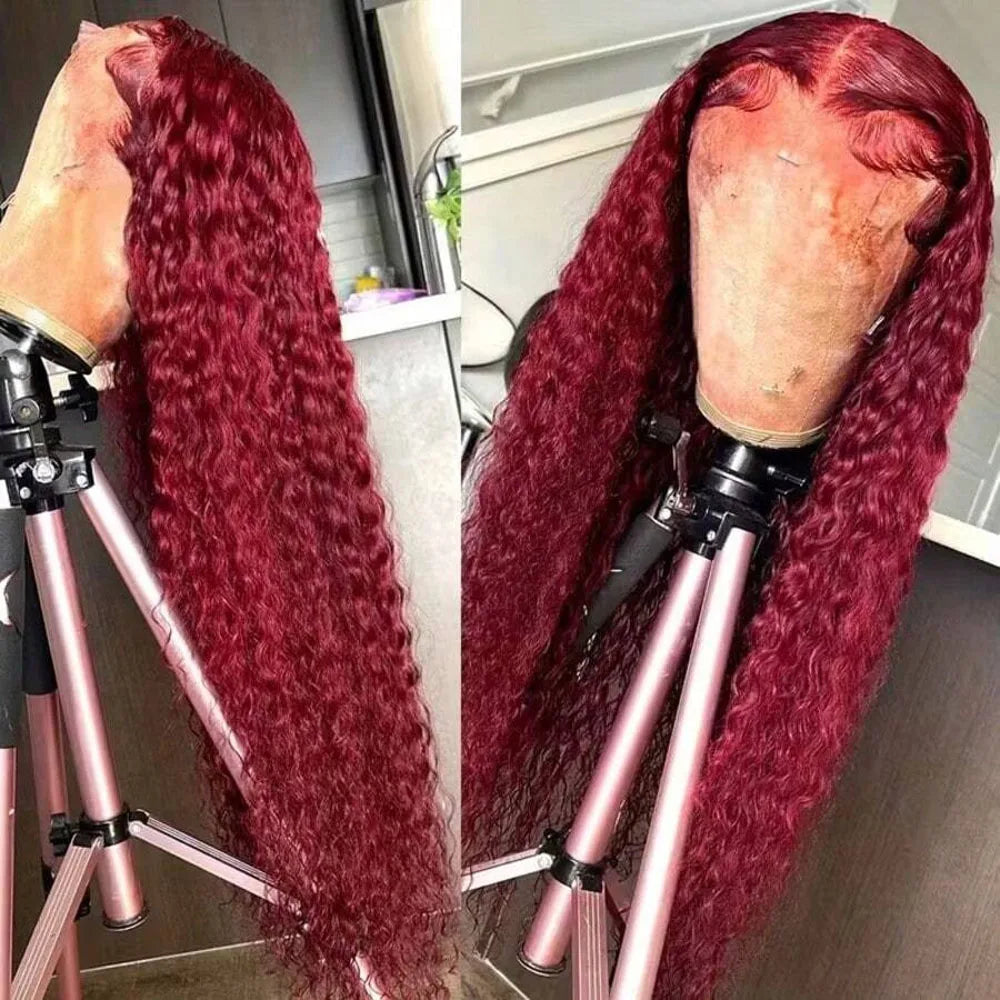 Red wig on a mannequin head with a tripod stand, set against a kitchen background.