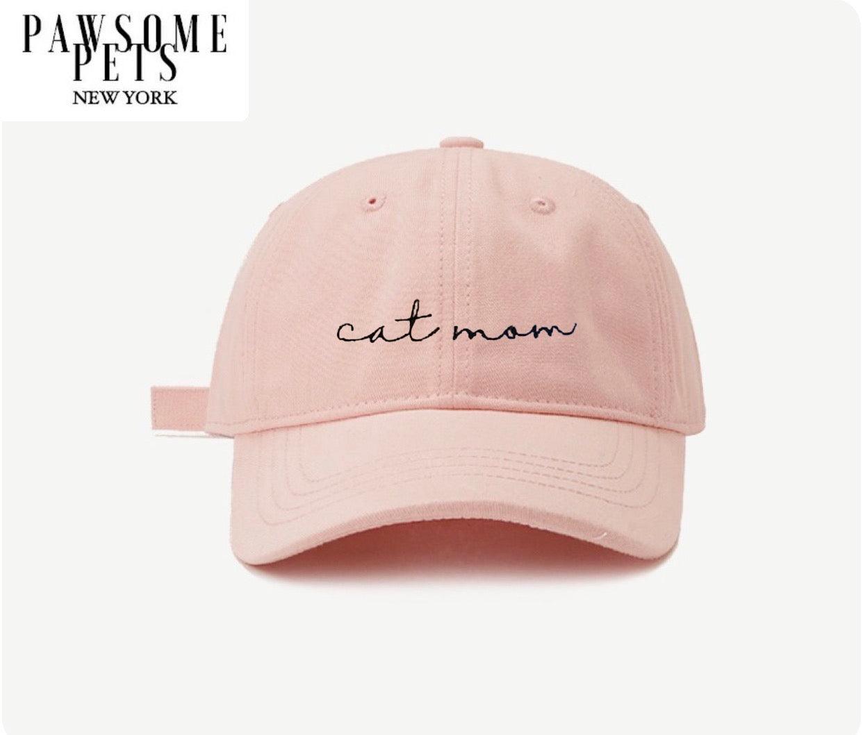 Pink cap with 'cat mom' text on a white background, branded 'Pawsome Pets New York'.