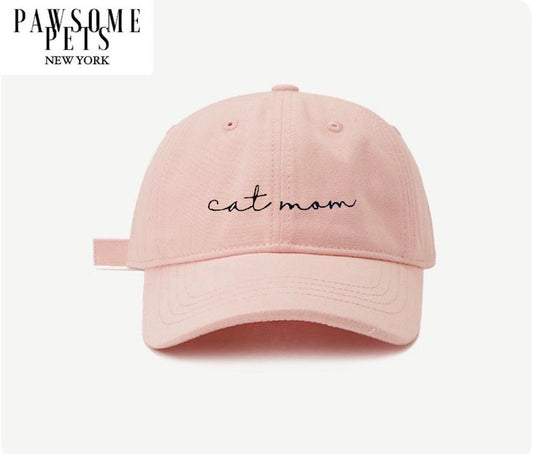 Pink cap with 'cat mom' text on a white background, branded 'Pawsome Pets New York'.