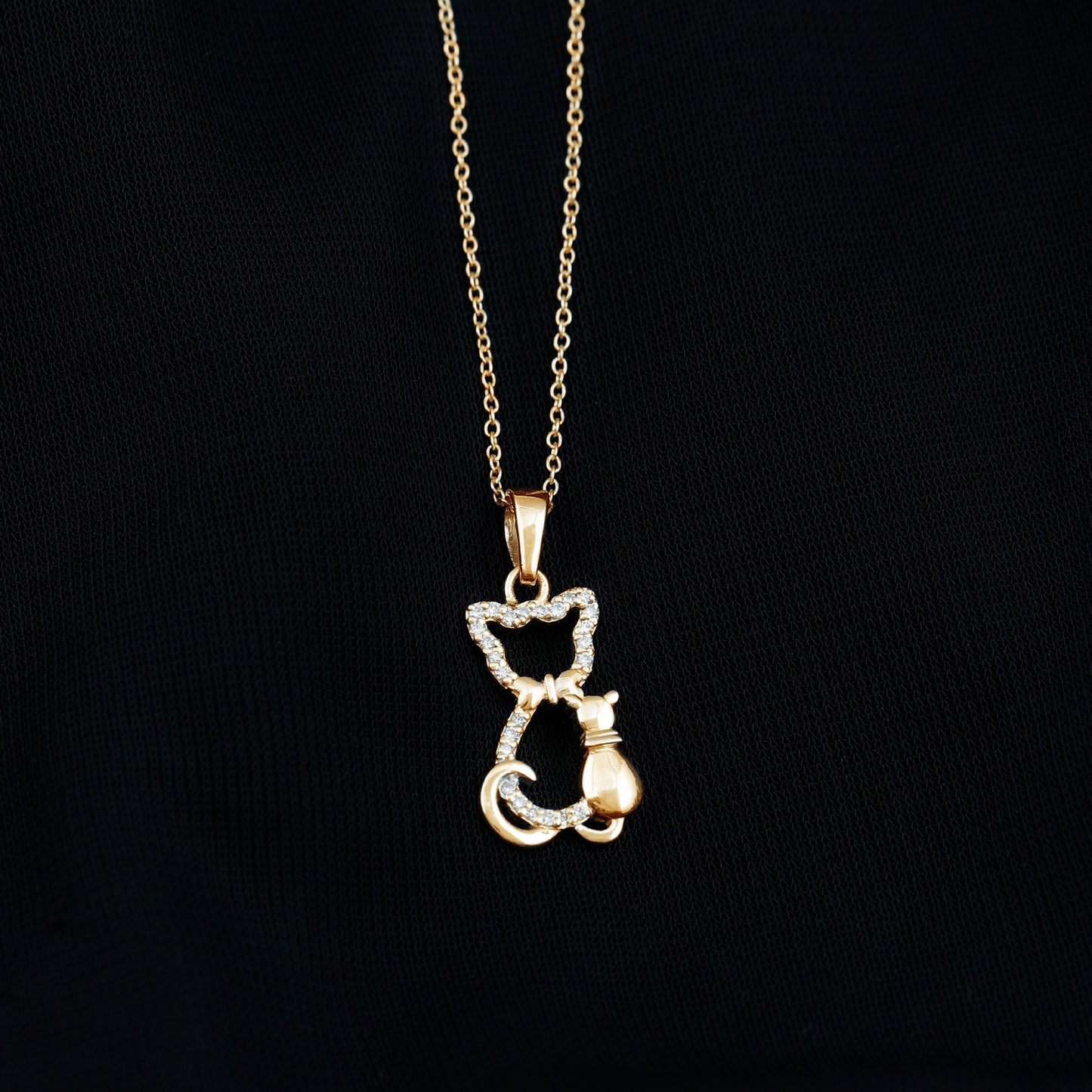 Gold cat-shaped pendant necklace on a black background Kitty Cat Necklace, Cat Pendant, Cat Lover Gift, Diamond Necklace, Diamond Pendant, Lab Diamond Necklace, Natural Diamond Necklace, Fine Jewelry, Luxury Jewelry, Sterling Silver Necklace, 10K Gold Necklace, 14K Gold Necklace, 18K Gold Necklace, White Gold Necklace, Yellow Gold Necklace, Pendant Necklace, Cat Jewelry, Animal Jewelry, Women's Jewelry, Unisex Jewelry, Gift For Her, Luxury Gift, Birthday Gift, Anniversary Gift, Valentine's Day Gift