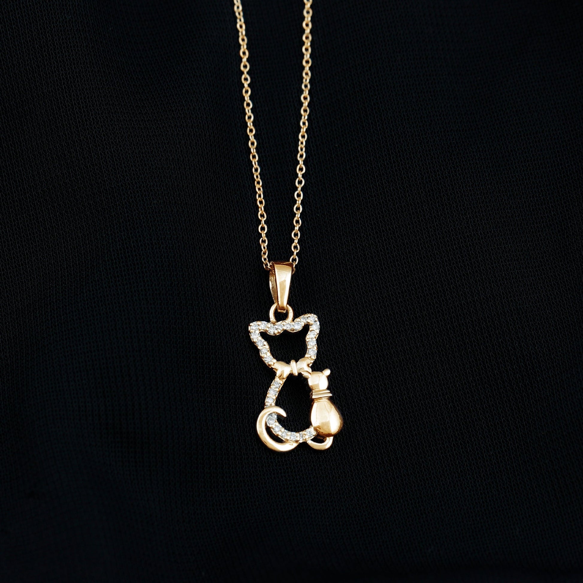 Gold cat-shaped pendant necklace on a black background Kitty Cat Necklace, Cat Pendant, Cat Lover Gift, Diamond Necklace, Diamond Pendant, Lab Diamond Necklace, Natural Diamond Necklace, Fine Jewelry, Luxury Jewelry, Sterling Silver Necklace, 10K Gold Necklace, 14K Gold Necklace, 18K Gold Necklace, White Gold Necklace, Yellow Gold Necklace, Pendant Necklace, Cat Jewelry, Animal Jewelry, Women's Jewelry, Unisex Jewelry, Gift For Her, Luxury Gift, Birthday Gift, Anniversary Gift, Valentine's Day Gift