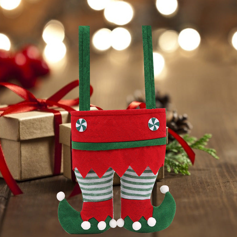Whimsical elf-themed Christmas gift bag with festive red and green felt design, striped elf legs, curled shoes, and sturdy handles, perfect for holiday gift giving, Christmas party favors, candy, and seasonal decorations.
