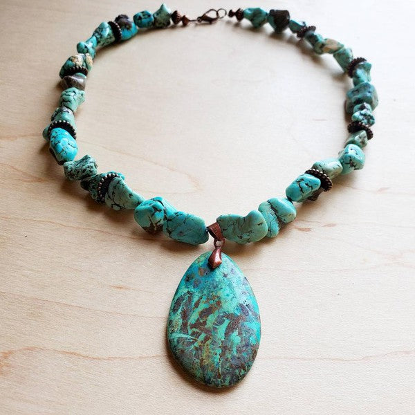 Chunky Turquoise Necklace Teardrop Pendant TURQUOISE • TEAL • STATEMENT ENERGY
Chunky Turquoise Teardrop Pendant Necklace

Make a bold entrance with a chunky turquoise necklace that features a stunning teardrop pendant—the kind of piece that transforms a basic outfit into a whole vibe. Casual tee? Elevated. Date-night look? Instant impact. Because honestly… you can never have too many show-stopping statement pieces.