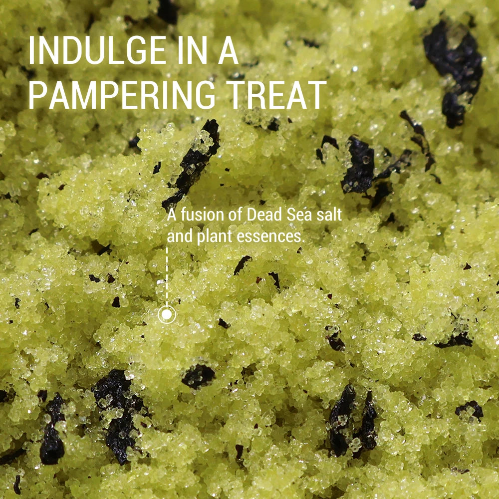 Close-up of green salt with black specks and text about a pampering treat.