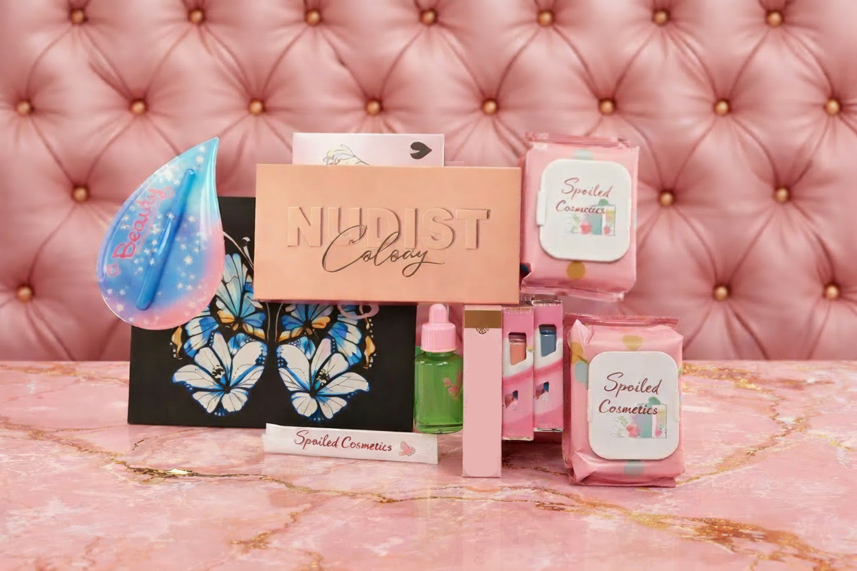 Collection of 'Nudist Colony' Brand and 'Savvy' cosmetic products on a pink textured background Collection of beauty products on a pink surface with a tufted pink background beauty_bundle_-_spoiled_cosmetics
