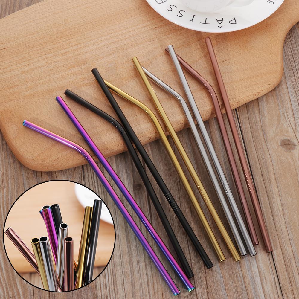 Set of colorful metal straws on a wooden surface with a close-up inset.