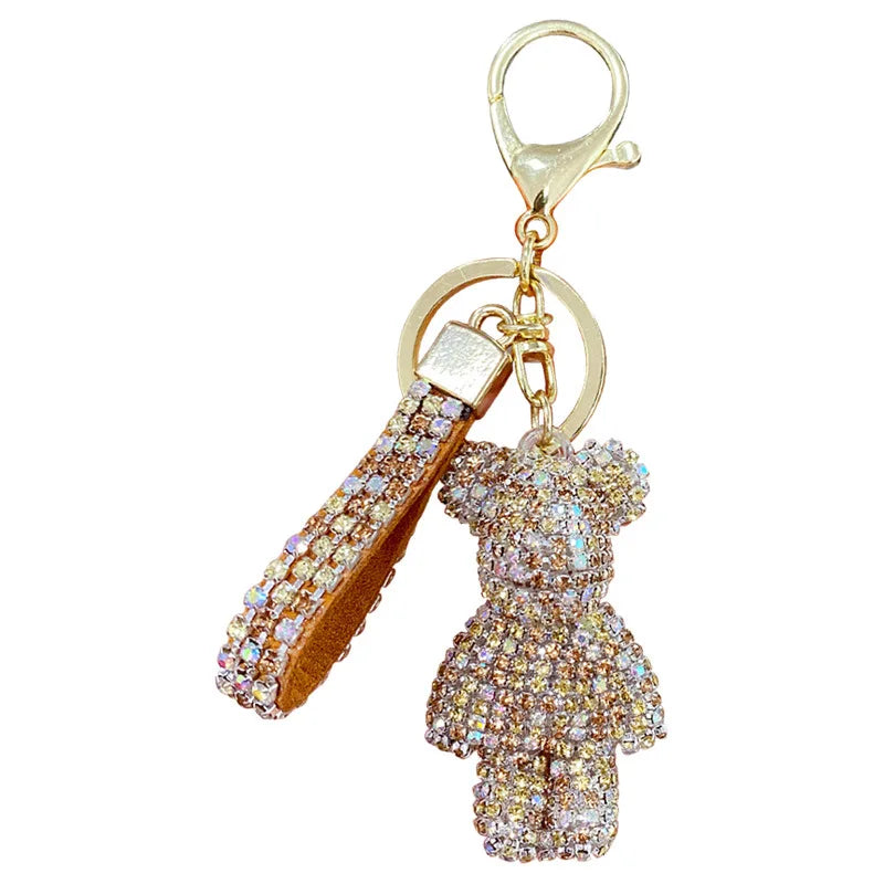 a Sparkling rhinestone teddy bear keychain with tassel and gold clasp for keys, purses, handbags, backpacks, and bag charms.