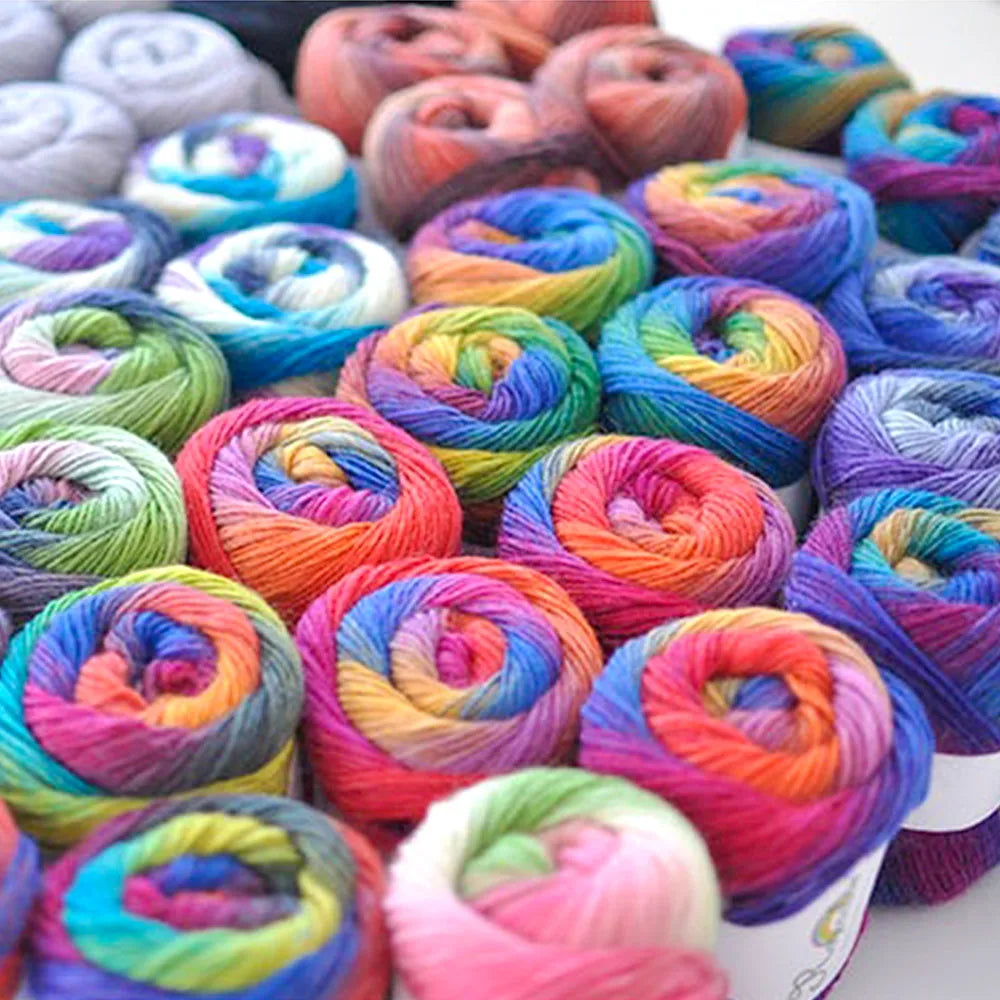 Assorted colorful yarn rolls on a white background. 50g/Ball Multicolor Self-Striping 100% Wool Yarn Chunky Knitting for Women Scarves Cape Making Gift Idea Handmade Craft Supplies