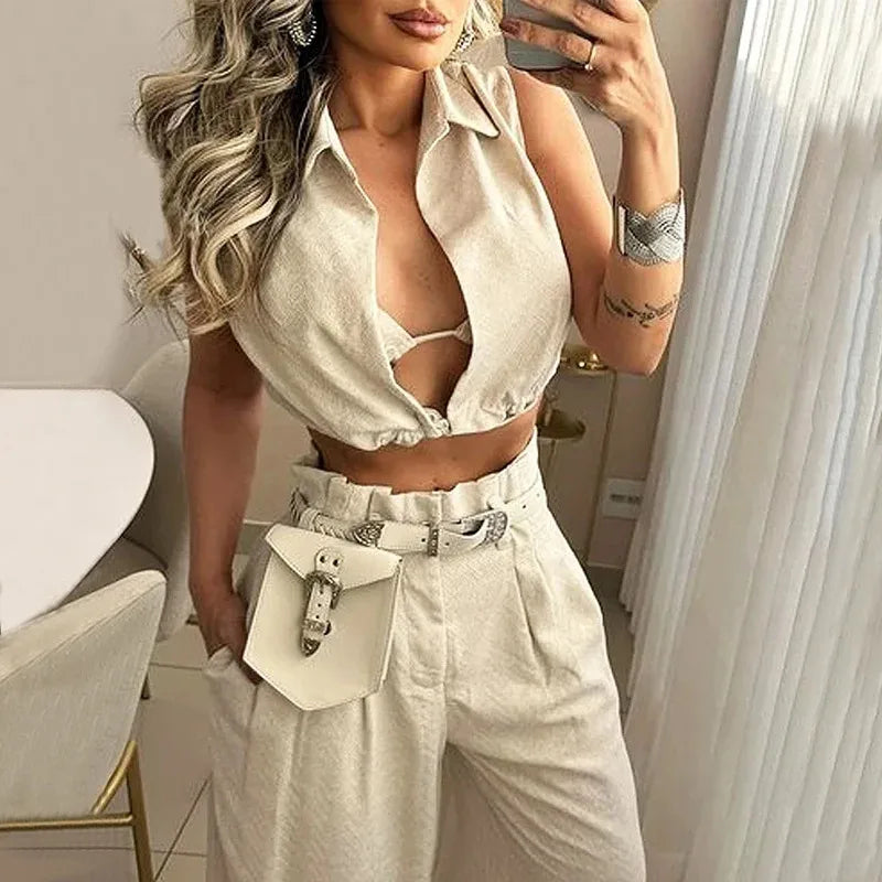 Women's sleeveless solid color polyester two-piece pants set with collared crop top, high-waisted wide leg pocket pants, chic matching co-ord outfit, elegant casual women's fashion set, summer vacation lounge wear, boutique women's clothing, monochrome matching separates, LuxeByMimi