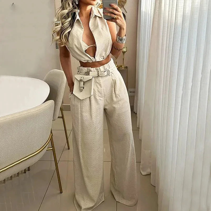 Women's sleeveless solid color two piece pants set with cropped button front top, wide leg high waist pocket trousers, matching co ord outfit, elegant casual summer fashion for women, beige polyester lounge set, vacation and travel wear, boutique women's clothing