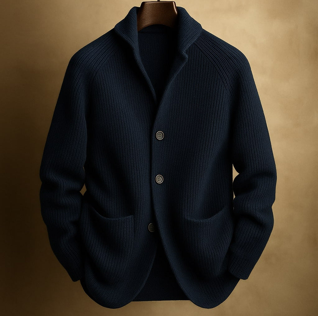 Dark blue blazer mens on a hanger against a beige background