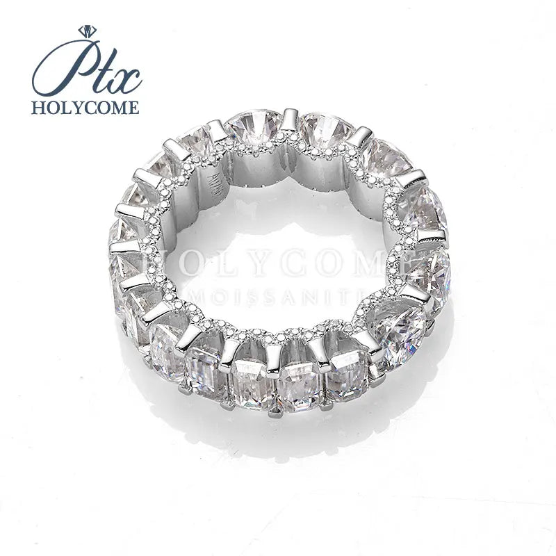 Diamond ring with 'PTC HOLYCOME' branding on a white background Silver ring with clear gemstones on a white background Diamond ring with 'Ptac HOLYCOME' branding on a white background Moissanite brilliant cut ring 14K Gold Plated Brilliant Round Cut Moissanite Cluster Gemstone Ring
