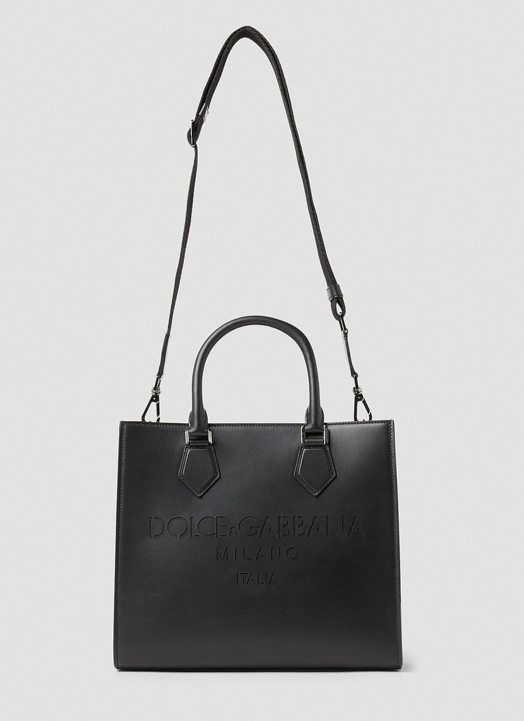 Black handbag with 'Dolce & Gabbana' branding on a light gray background