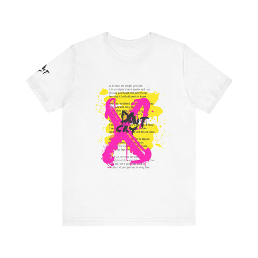 White t-shirt with pink ribbon design and text on a white background. White unisex T-shirt featuring a vibrant graffiti-inspired "Don't Cry" pink ribbon design layered over an inspirational self-love poem with yellow paint splatter accents.