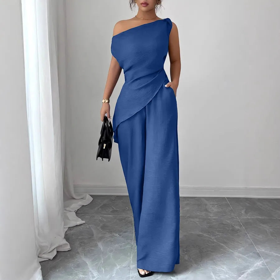 Elegant solid color women's pants co-ord set in blue polyester fabric with one-shoulder sleeveless top, wide-leg pants, zipper closure, side pockets, casual office outfit, vacation and resort wear.