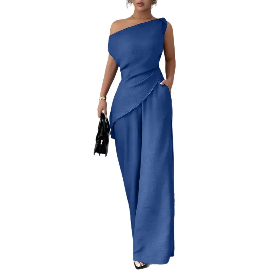 Elegant solid color women's one-shoulder pants co-ord set in blue polyester fabric with asymmetric draped top, zipper closure, wide-leg pants, side pockets, casual office outfit, matching two-piece set.