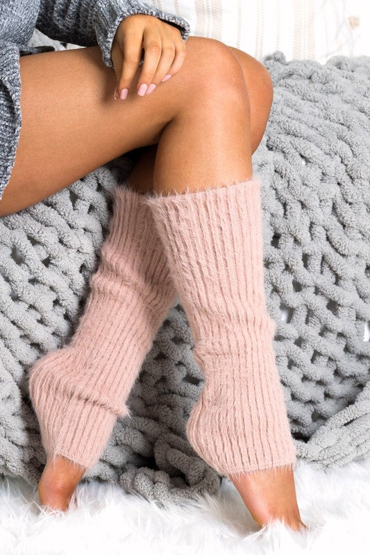 Person wearing pink leg warmers sitting on a textured gray blanket. * 100% Buttery soft-spun acrylic

Stretch fabric