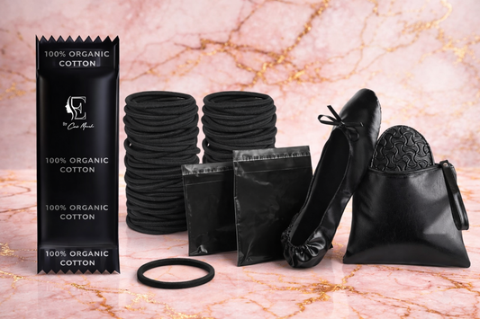 Black organic cotton tampons emergency flat shoes barf bag sanitary napkin disposal bag and hair scrunchies products including packaging, hair ties, and shoe bags on a marble background