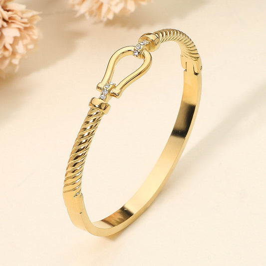 SECRET BOX_Stainless Steel Horsebit Buckle Accent Twisted Hinged Bangle Bracelet