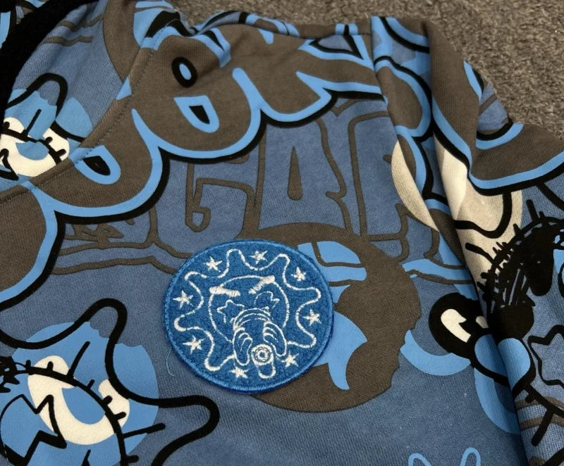 Fabric with cartoon character design and blue patch on a brown background
