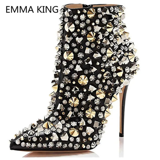 Black high-heeled boot with gold and silver embellishments on a white background, featuring the brand 'Emma King'.