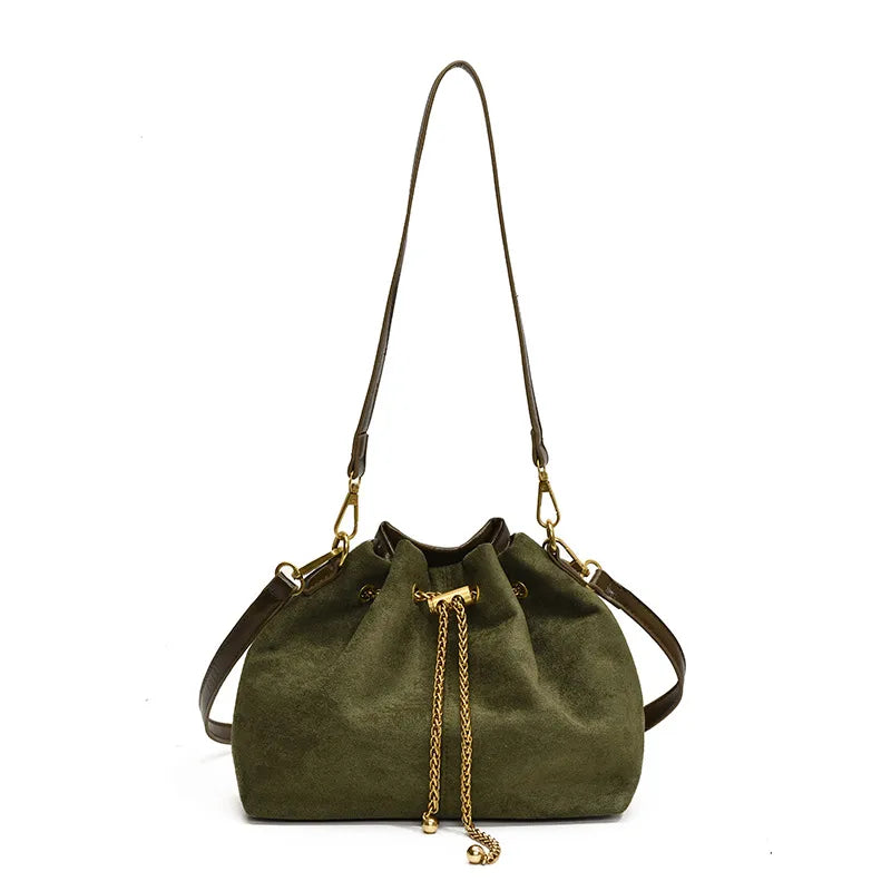 Olive green frosted PU leather bucket bag with gold chain drawstring detail and adjustable shoulder strap on a white background. Women's crossbody handbag with a stylish retro design for everyday wear.
