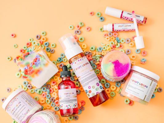 Assorted beauty products including bottles and jars on a colorful background with cereal pieces. "FRUT LOOPS" BUNDLE - Bath & Body Gift Set What’s included
Whipped Body Butter • Sugar Scrub • Body Oil • Lip Gloss — a full routine for ultra-hydrated, smooth, radiant results.