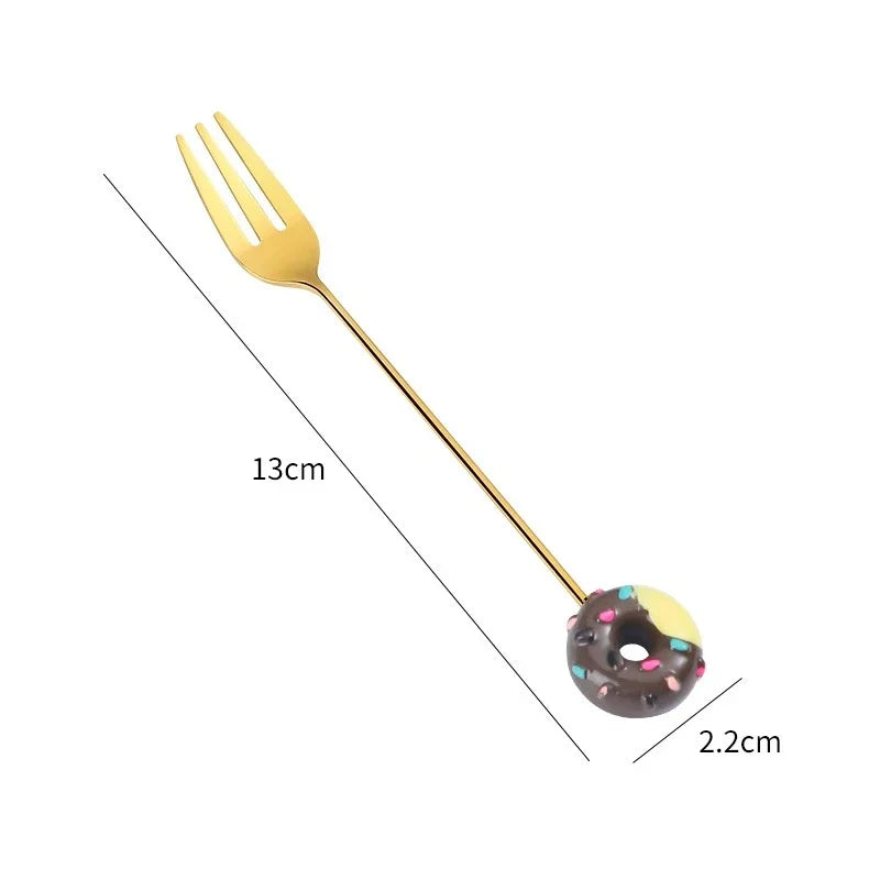 Gold-colored spoons and forks with colorful donut-shaped ends on a pink background teaspoons stirring spoons dessert fork dessert spoon mini utensils miniature fork and spoon set. Cute Donut Scooping Spoon + Fork (Stainless Steel Stirring Spoons Dessert Utensils)