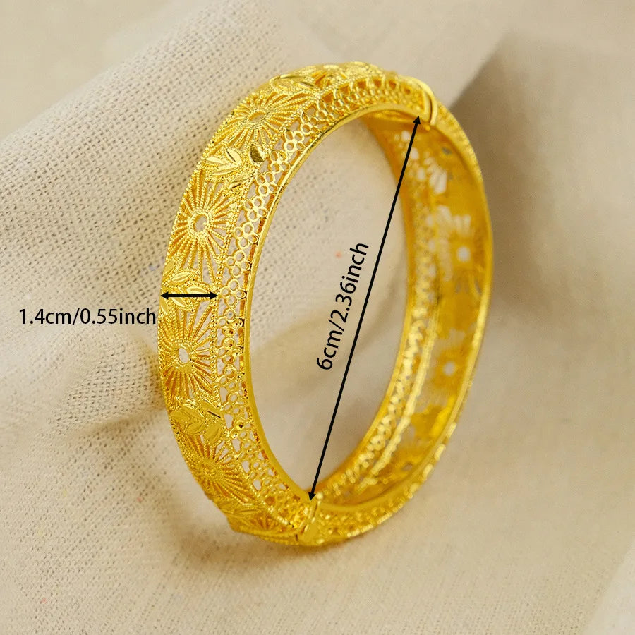 Gold bracelet with measurements on a beige fabric background