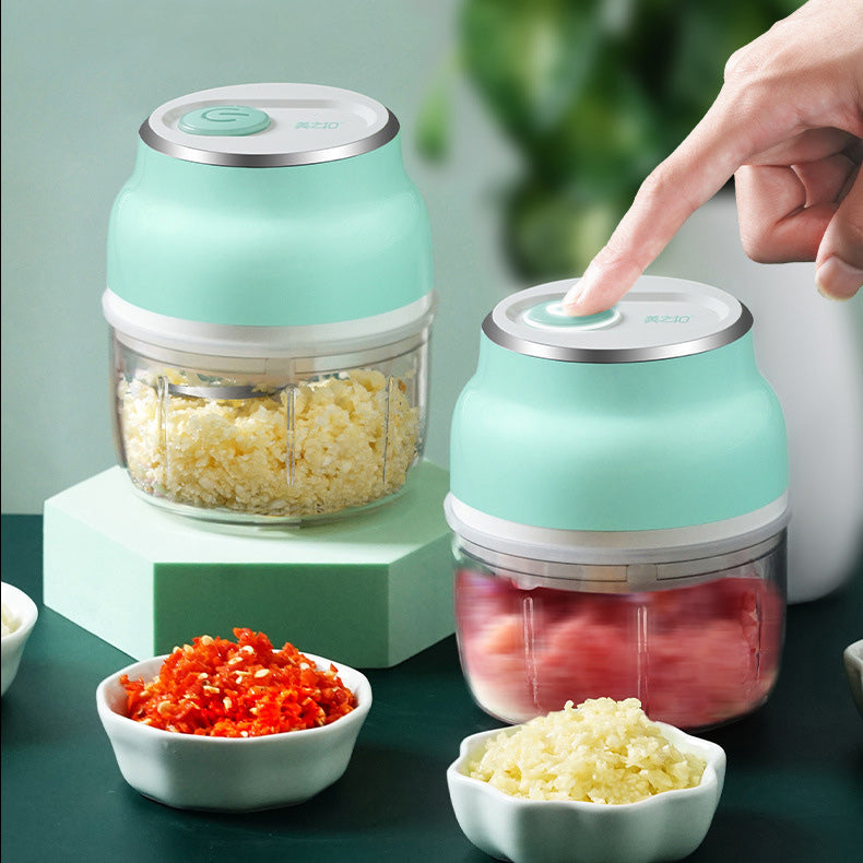 Green kitchen chopper with ingredients on a green background