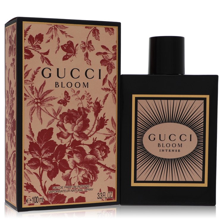 Gucci Bloom Intense perfume shown with its black and beige floral box and the black rectangular bottle with a black cap on a white background. Gucci Bloom Intense by Gucci Eau De Parfum Spray 3.3 oz for Women