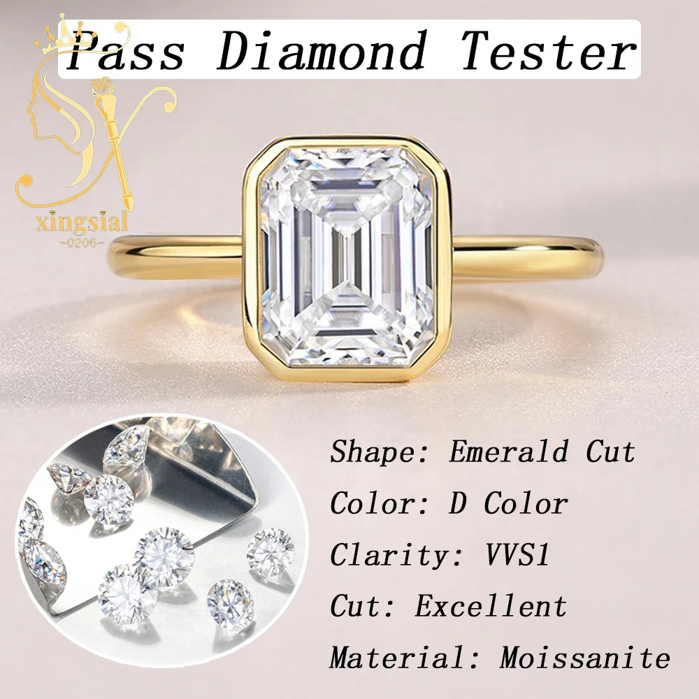 Gold ring with emerald-cut diamond and 'Pass Diamond Tester' text, featuring xingsial logo.