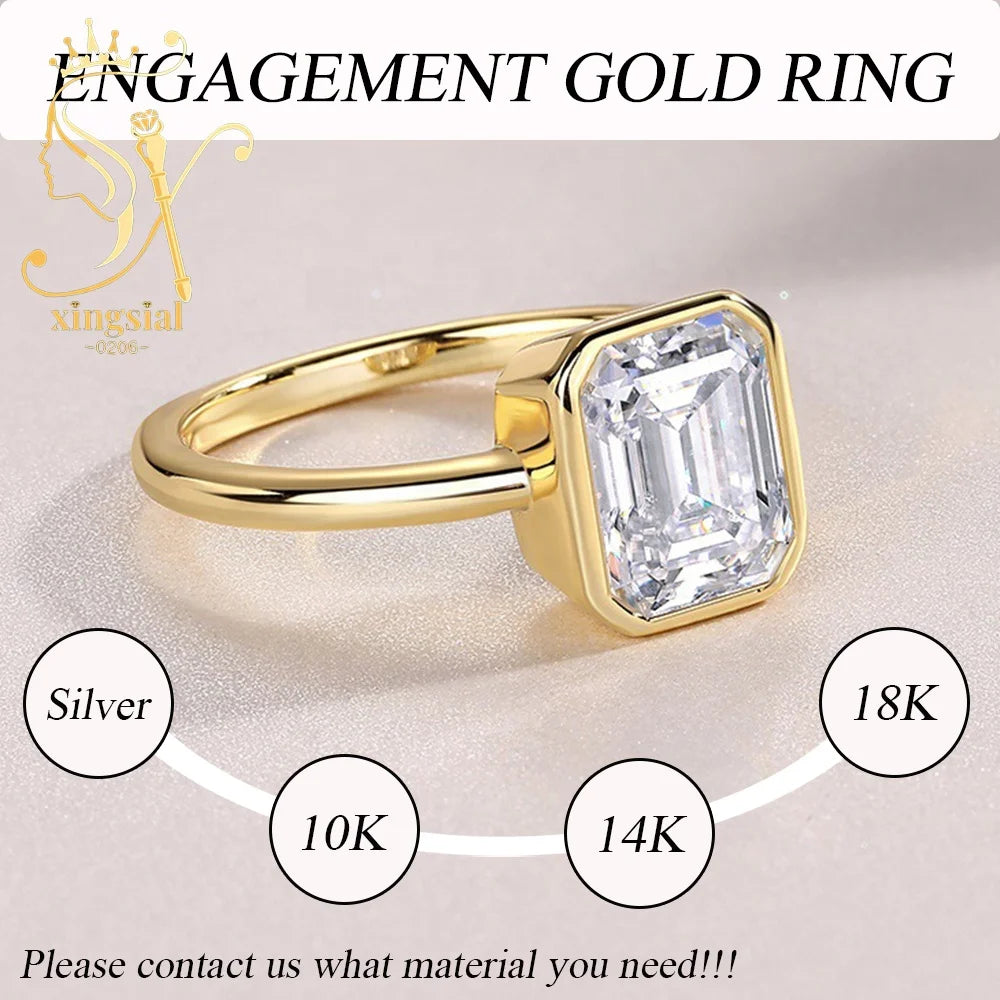 Gold engagement ring with diamond on a light background, featuring the brand 'Xingsial'.