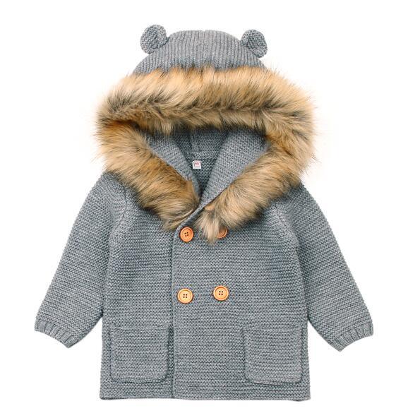 Children's gray coat with fur-lined hood on a white background