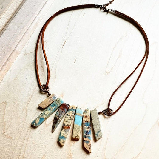 Dive into effortless elegance with this handcrafted Aqua Terra necklace, where genuine stones meet supple leather in perfect harmony. The adjustable design stretches from 18" to 24"—just pull the cords to find your sweet spot. Layer it with your favorites or let it shine solo as a stunning statement piece. Since each one is lovingly made by hand, yours is truly one-of-a-kind. Nature's artistry, personalized just for you.
