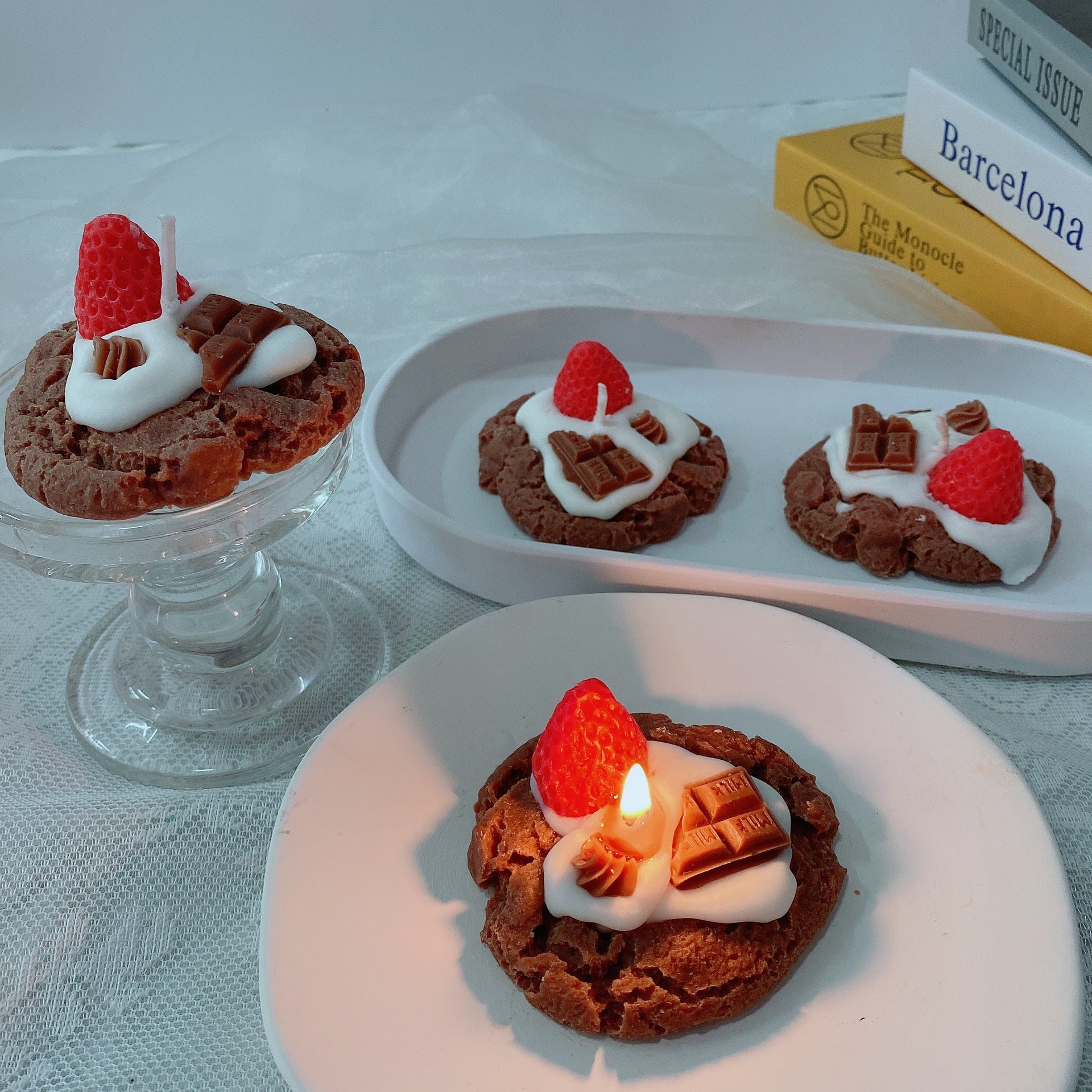 Handmade Strawberry Cake Aromatic Candle Decoration. Chocolate cookies with whipped cream and raspberries on a white plate. Indulge your senses with this delightful handmade strawberry cake aromatic candle! Crafted from eco-friendly soybean wax, this charming sector-shaped beauty fills your space with a sweet, bakery-fresh fragrance that's absolutely irresistible. 