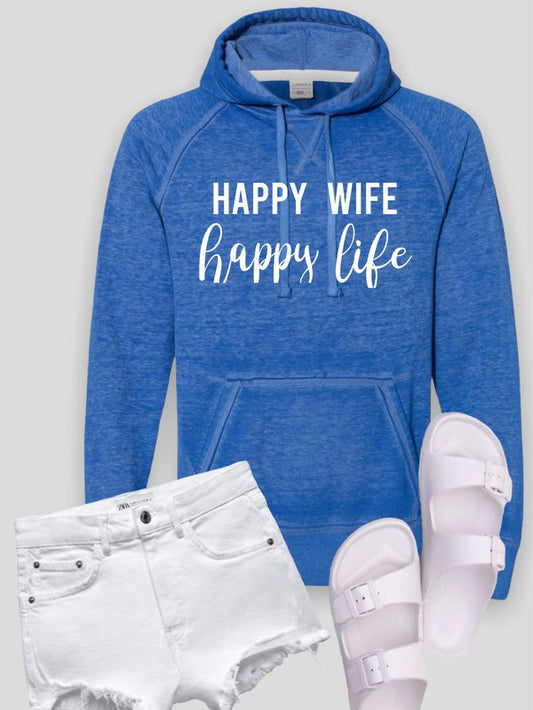 Blue hoodie with 'Happy Wife Happy Life' text, white shorts, and white sandals on a light gray background