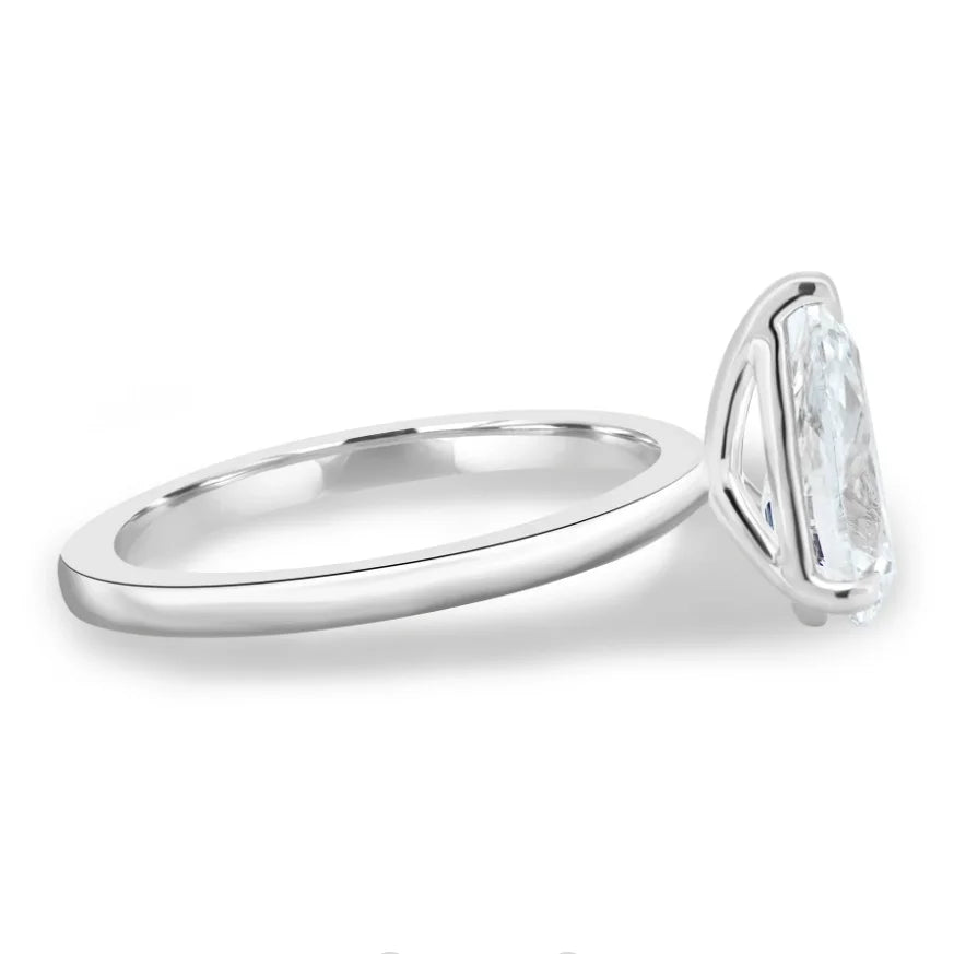 Silver ring with a large diamond on a white background