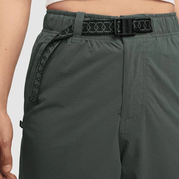 Green pants with a black belt on a white background. These lightweight, sweat-wicking pants are made for movement and comfort. With 6 pockets