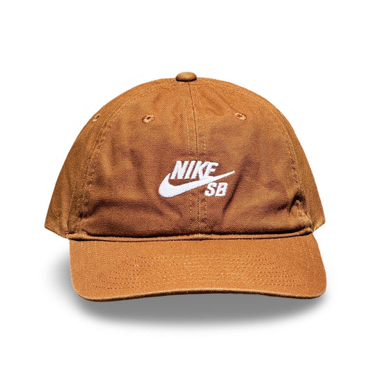 A brown Nike SB baseball cap with a white embroidered logo on the front, shown against a plain white background. Nike SB Club Cap - Dark Russett
