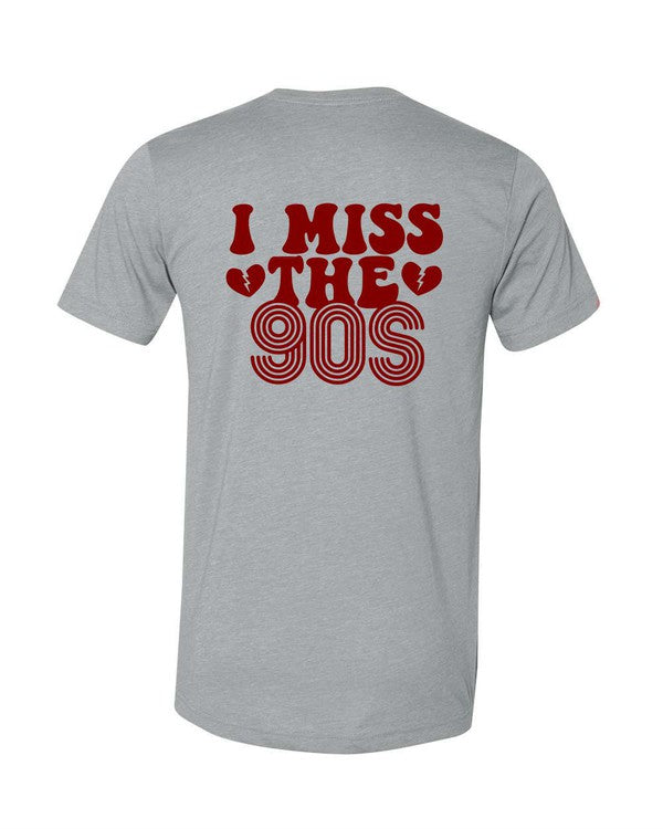 Vintage heather gray softstyle T-shirt with bold red "I Miss The 90s" retro graphic printed on the back, featuring nostalgic 1990s-inspired lettering and broken heart accents.