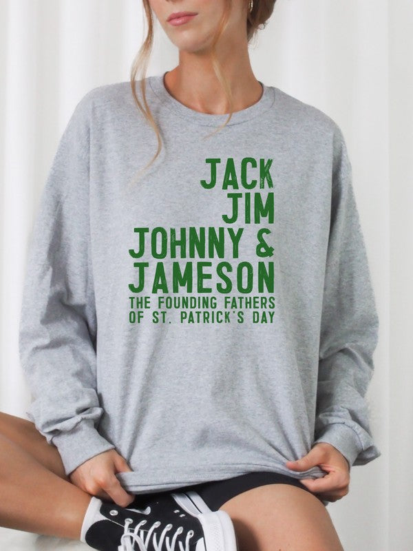 Woman wearing an Oxford grey plus size graphic sweatshirt featuring green "Jack Jim Johnny & Jameson – The Founding Fathers of St. Patrick's Day" text, styled with black shorts and black high-top sneakers.