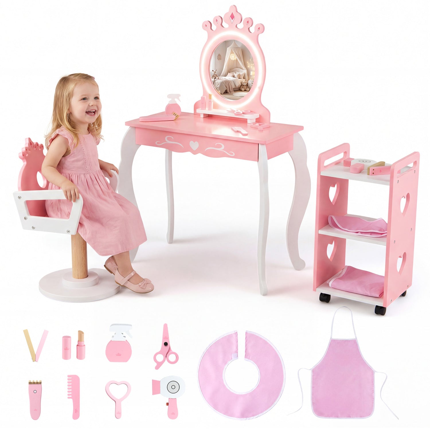 Pink toy vanity set with mirror, stool, and accessories on a white background