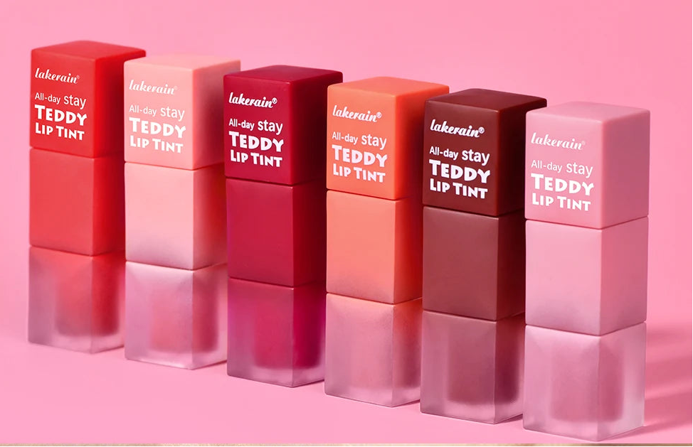 Lakewae Teddy Lip Tint packaging with lip swatches on a pink background
