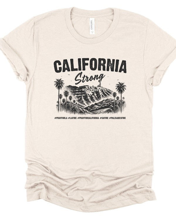 Beige unisex T-shirt featuring a black "California Strong" Hollywood graphic with palm trees and mountain landscape, crew neck, short sleeves, and soft cotton fabric.