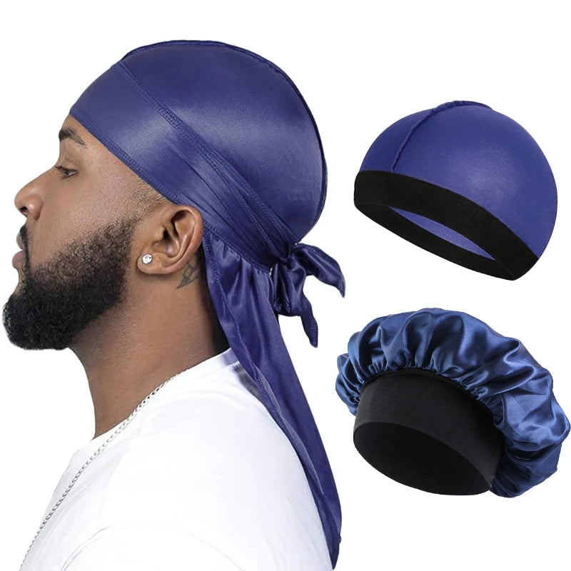 Man wearing a blue durag with additional durags displayed on a white background. blue satin hair wrap on a man with a white background. black mens bonnet headtie in blue 3 piece 3 pc durag, satin durag, silky durag, men durag, wave cap, pirate durag, long tail durag, unisex durag, bonnet set, satin bonnet, headwrap, turban cap, wig cap, hair care, sleep cap, compression cap, wave brush style, streetwear accessory, black durag, luxury headwear